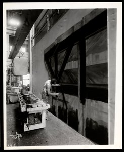 A Scenic Artist Painting a Flat in a Scene Shop, New York, 1915-6 by Byron Company